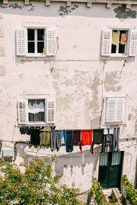 Low angle view of clothes drying outside house