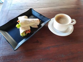 High angle view of coffee cup on table