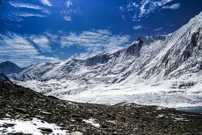 Scenic view of snowcapped mountains against sky