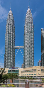 Low angle view of modern buildings against sky