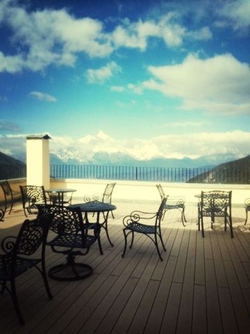 sky, railing, cloud - sky, empty, sea, tranquility, built structure, bench, wood - material, water, tranquil scene, boardwalk, nature, pier, cloud, absence, scenics, the way forward, shadow, architecture