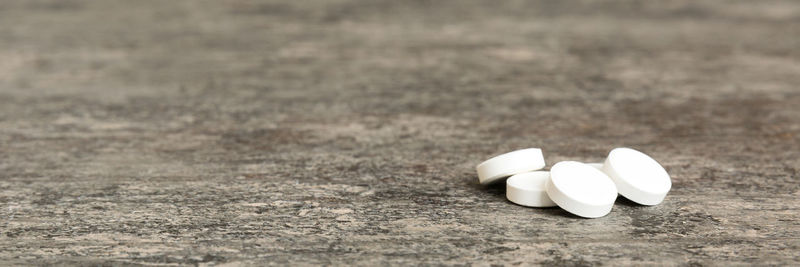 Close-up of pills on field