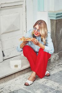 Happy woman having food