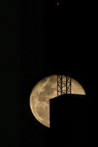 Low angle view of illuminated lights at night