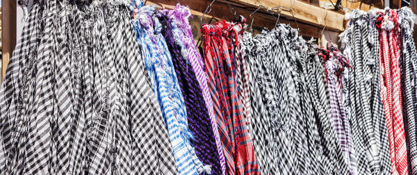 Close-up of clothes hanging in store for sale in market