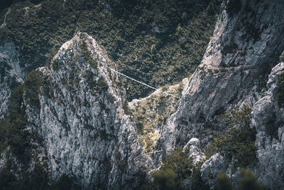 Aerial view of rope bridge on rock mountain