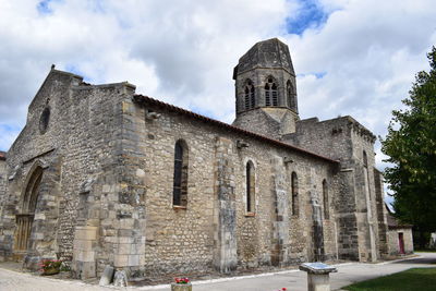 Exterior of temple against sky in city