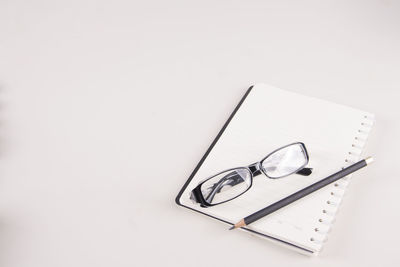 High angle view of pen on table against white background