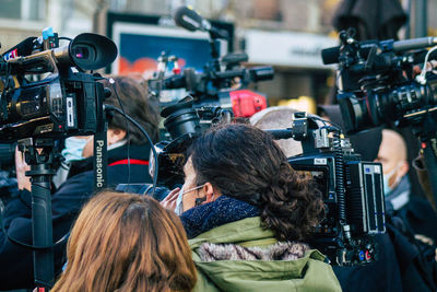 Rear view of people photographing