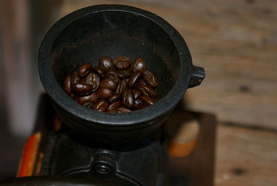 Close-up of roasted coffee beans in coffee maker