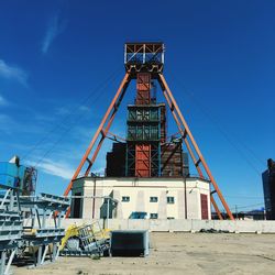 Low angle view of construction site against sky