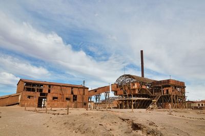 Abandoned construction site against sky