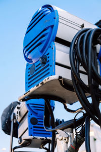 Low angle view of cables against clear blue sky