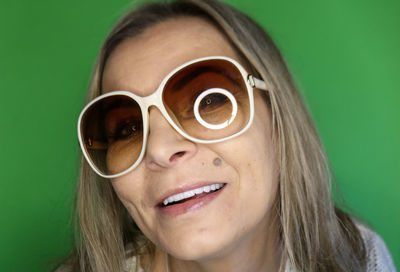 Portrait of young woman wearing sunglasses