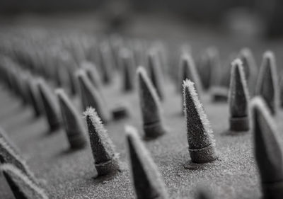 Close-up of frozen metal spikes