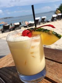 Close-up of cocktail on table at beach