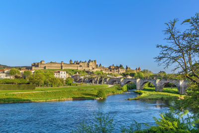 View of carcassonne fortress from aude river, france