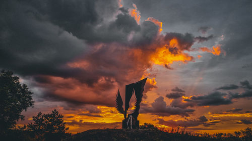 Scenic view of dramatic sky during sunset