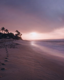 A wonderful long-exposure image of sunset beach in hawaii.