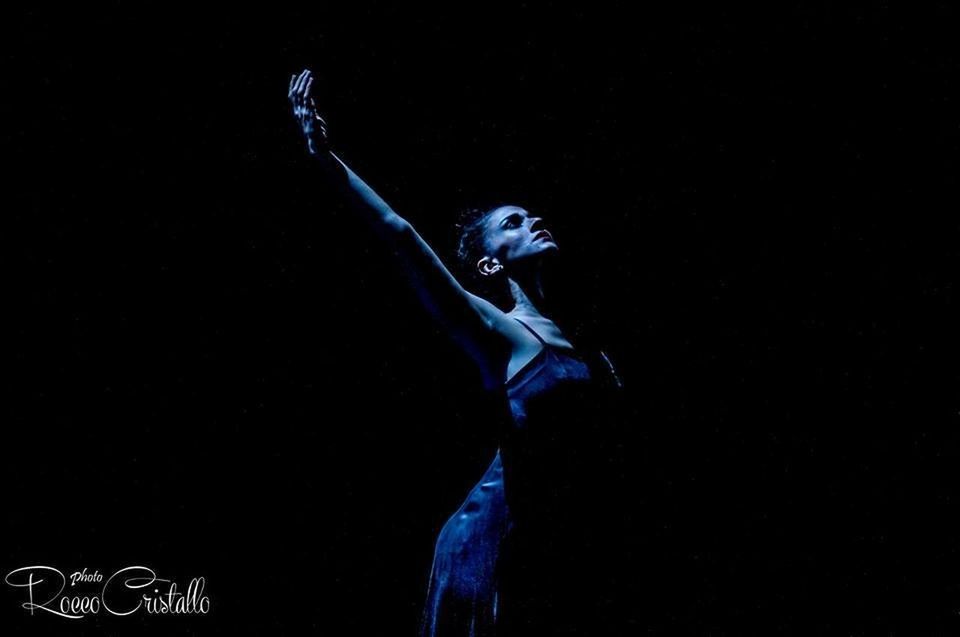 black background, studio shot, indoors, young adult, blue, one person, women, adult, copy space, standing, dancing, human arm, arms raised, motion, nature, dark, young women, illuminated, performance, purple