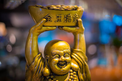 Close-up of laughing buddha statue