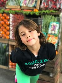 Portrait of girl standing at market