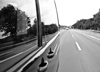 Cars on road against sky