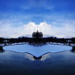 Scenic view of lake against sky during winter