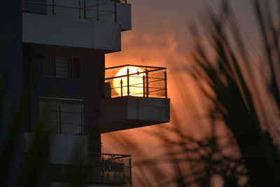 Low angle view of building against sky during sunset