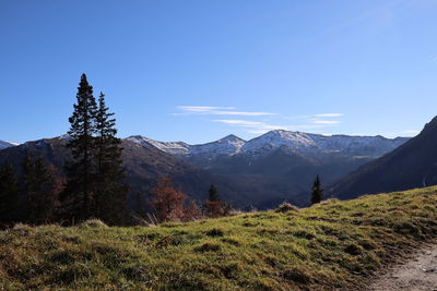 Scenic view of mountains against clear blue sky