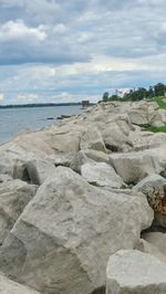 Scenic view of sea against cloudy sky