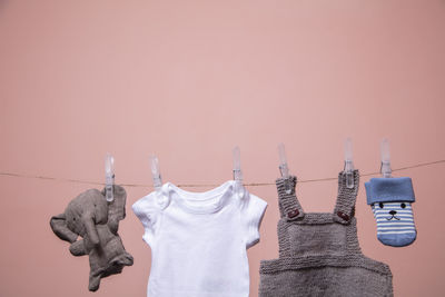 Low angle view of clothes hanging against wall