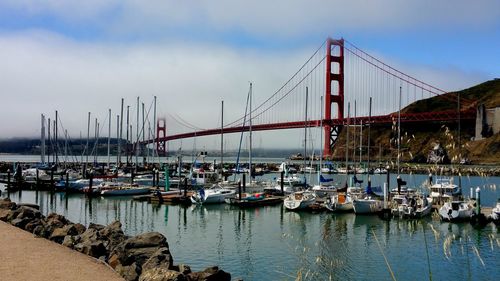 Scenic view of boats in harbor close to golden bridge san francisco