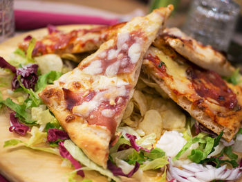 Close-up of pizza served in plate