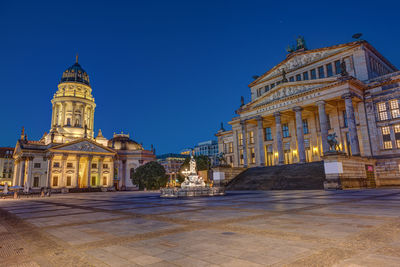 The gendarmenmarkt square in berlin at dawn with no people