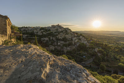 Scenic view of cityscape against sky during sunset