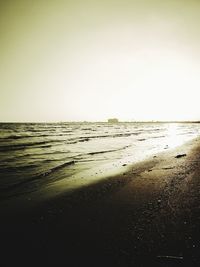 Scenic view of beach against clear sky