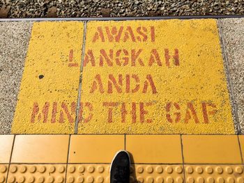 Close-up of yellow text