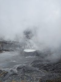 Smoke emitting from volcanic mountain