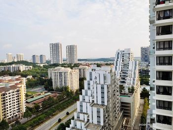 High angle view of buildings in city against sky