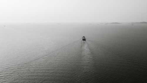 Black and white photo container ship full load carrying for import and export, business cargo 