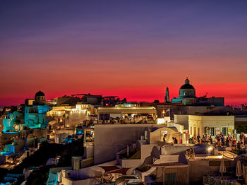 View of buildings in city at sunset