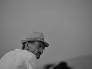 Portrait of man wearing hat against sky