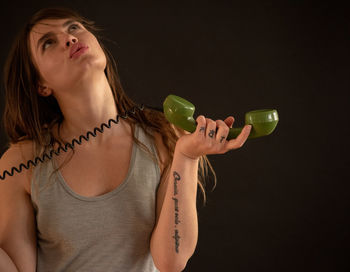 Midsection of a woman drinking glass