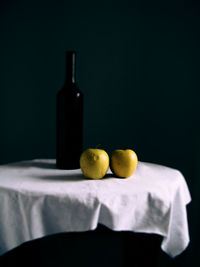 Close-up of eggs on table against black background