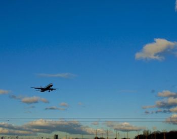 Low angle view of airplane flying in sky