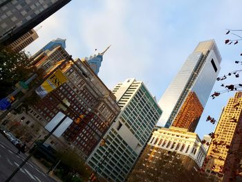 Low angle view of buildings against sky in city