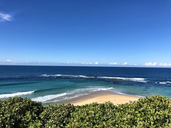 Scenic view of sea against clear blue sky