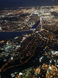 Aerial view of illuminated cityscape at night