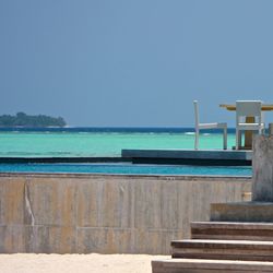 View of calm blue sea against clear sky